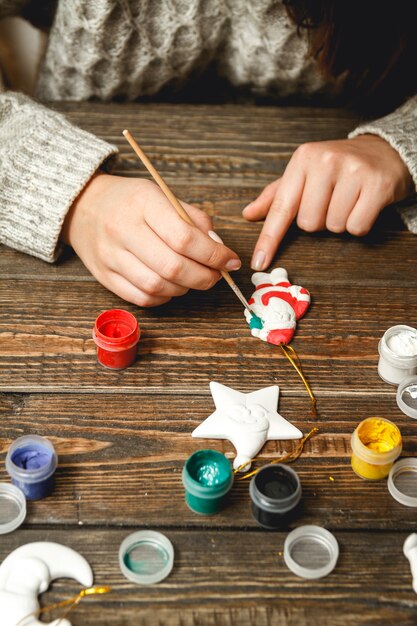 Woman creating stylish Christmas gifts