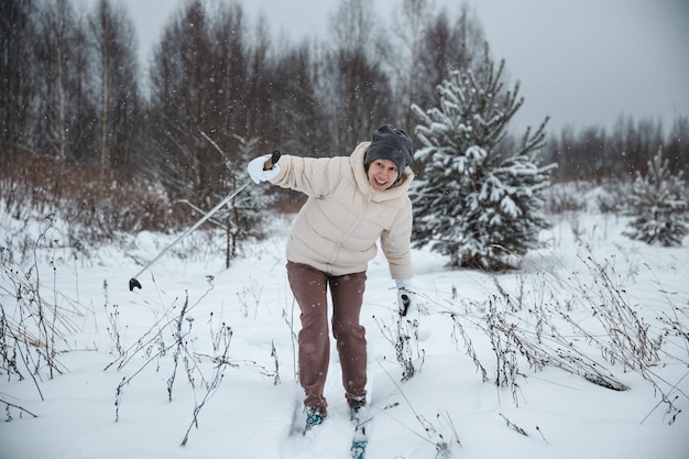 A woman on crosscountry skiing in a winter forest a healthy lifestyle concept a sporty lifestyle