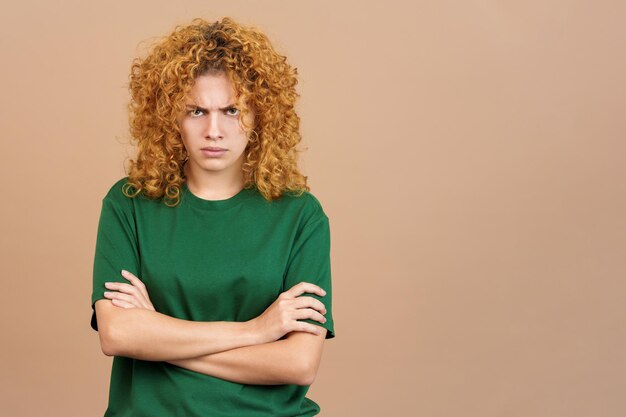 Woman crossing the arms with an angry expression