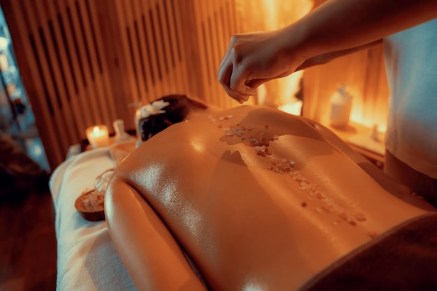 Woman customer having exfoliation treatment in luxury spa Quiescent