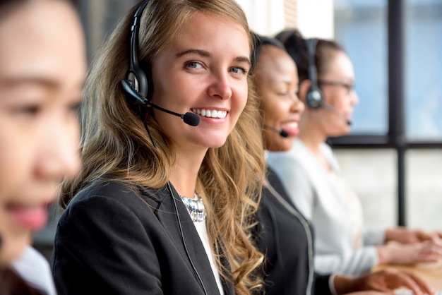 Woman customer service agent working in call center 