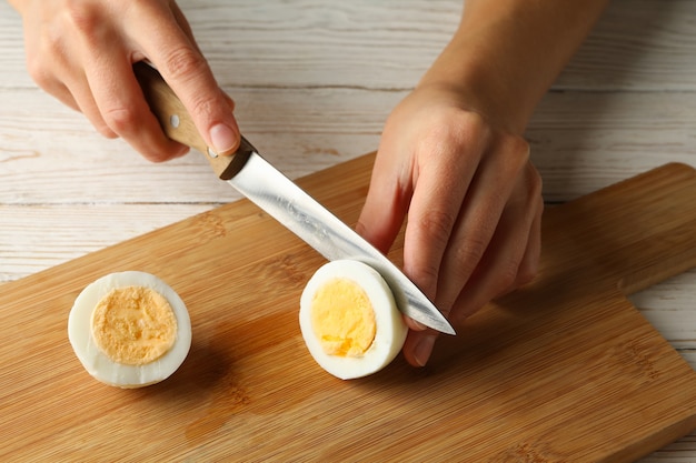 Woman cuts boiled egg