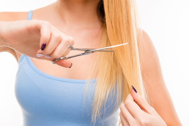 Woman cuts her hair