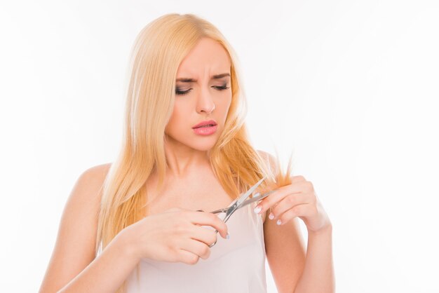 Woman cutting her hair