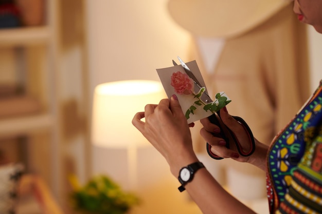 Woman Cutting out Picture of Flower