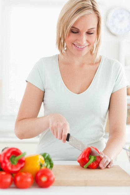 Woman cutting peppers