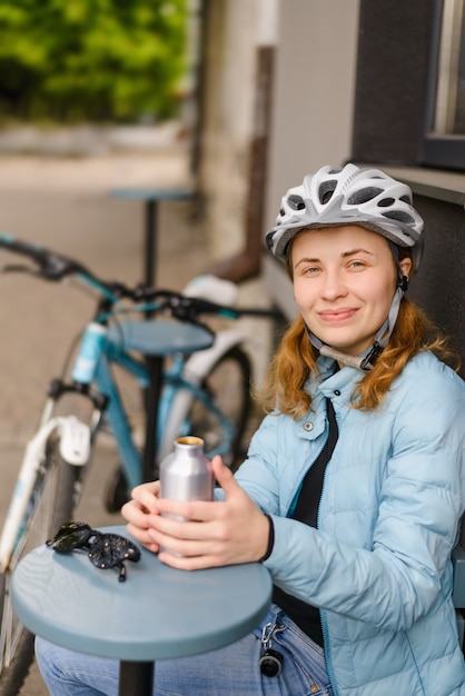 Woman cyclist in a helmet smiling