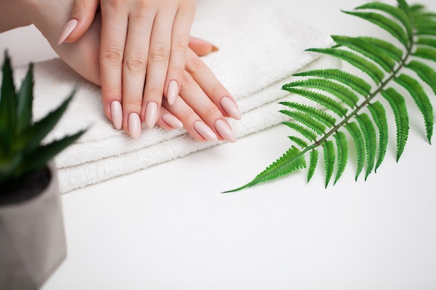 Woman demonstrates a fresh manicure