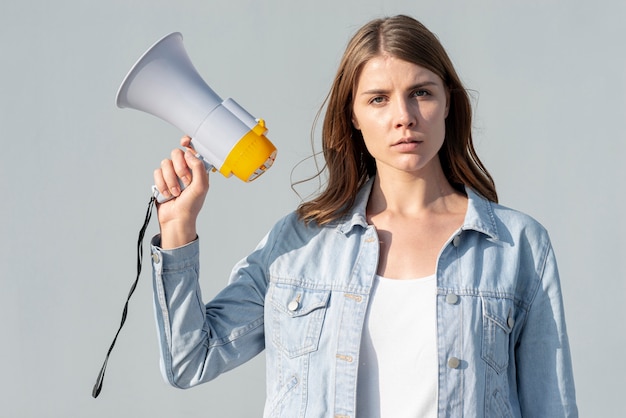 woman demonstrating for peace with megaphone