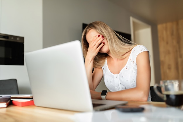 Woman in depression at home office