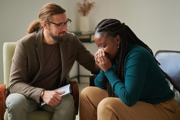 woman in depression talking to psychotherapist
