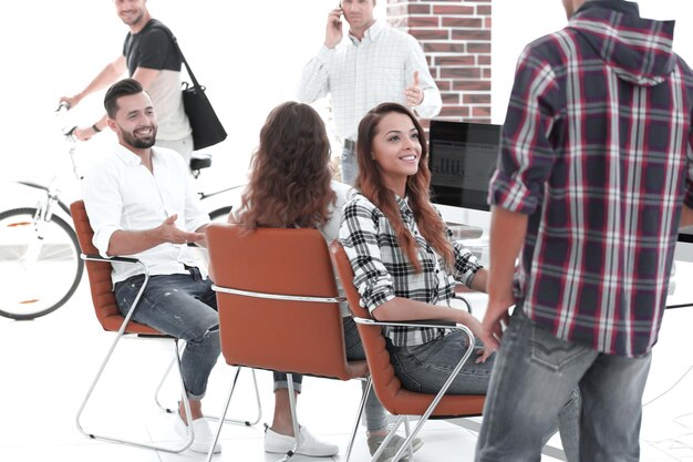 Woman designer talking with a colleague