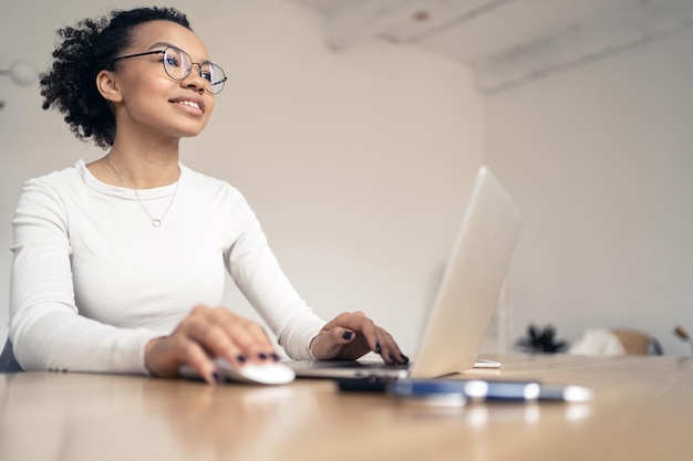 A woman designer with glasses is passionate about working in the office with documents Workplace