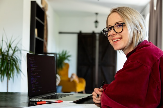 Woman developer working with computer at home office