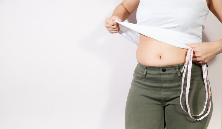 Photo woman diet lifestyle concept to reduce belly and shape up healthy stomach muscle.