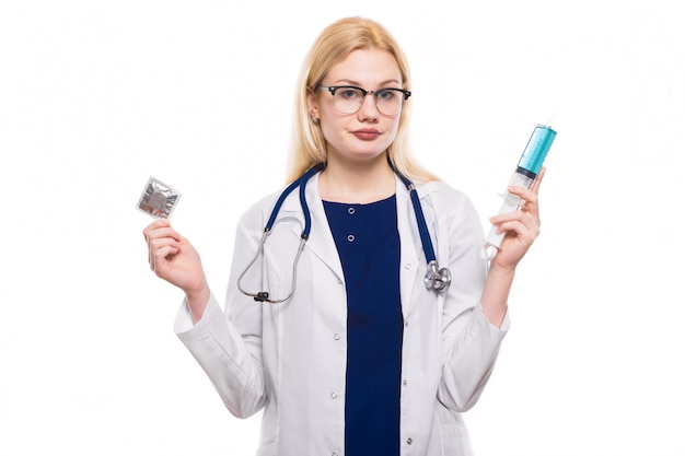 Woman doctor hold condom and injection