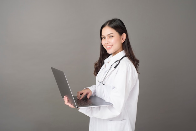 Woman Doctor is using  laptop