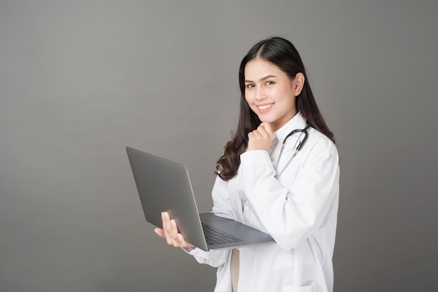 Woman Doctor is using  laptop