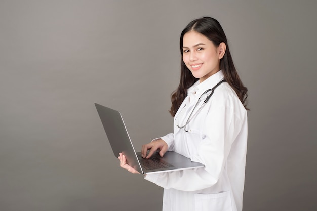 Woman Doctor is using  laptop