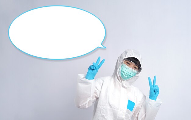 Woman doctor in PPE or personal protection equipment suit and medical mask and glove for protect