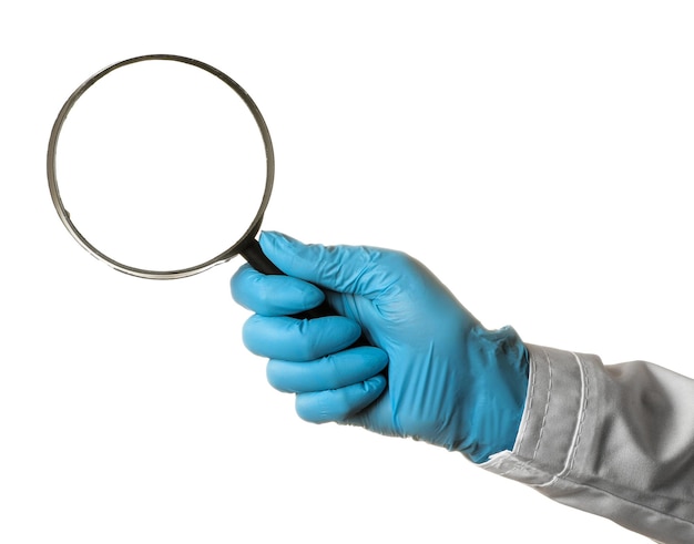 Woman doctor's hand is holding a magnifying glass on a white isolated background hand gestures