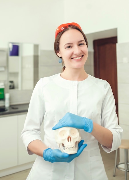 Woman doctor smiling in cabinet