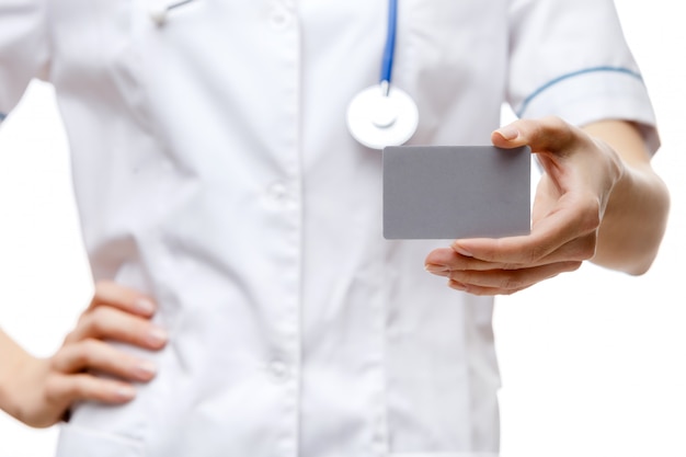 Woman doctor standing on white background