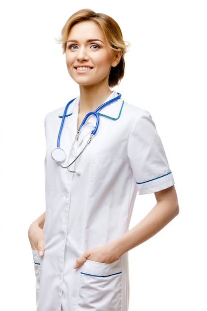 Woman doctor standing on white background