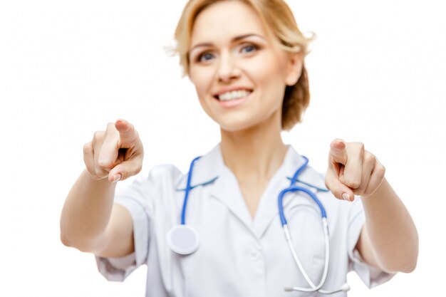 Woman doctor standing on white background