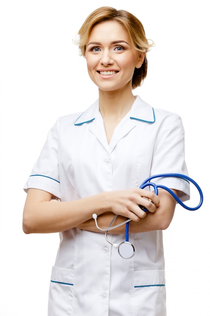 Woman doctor standing on white background