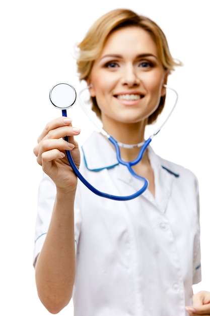 Woman doctor standing on white background