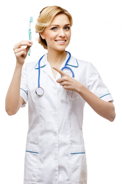 Woman doctor standing on white background