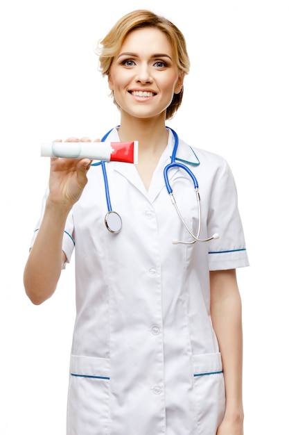 Woman doctor standing on white background