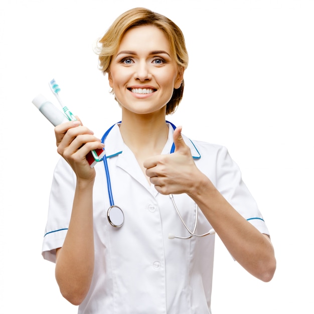 Woman doctor standing on white background