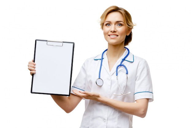 Woman doctor standing on white background