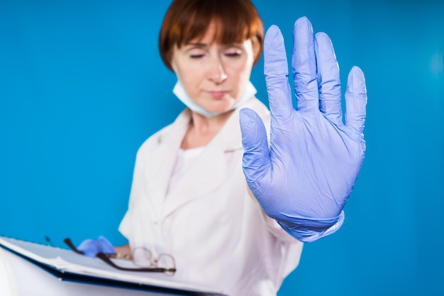 Woman doctor stops someone standing in front of her