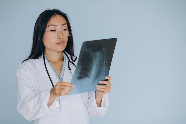 Woman doctor watching fracture on x-ray