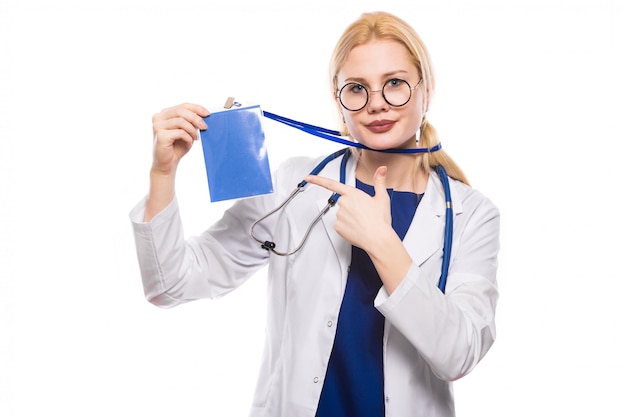 Woman doctor in white coat with badge