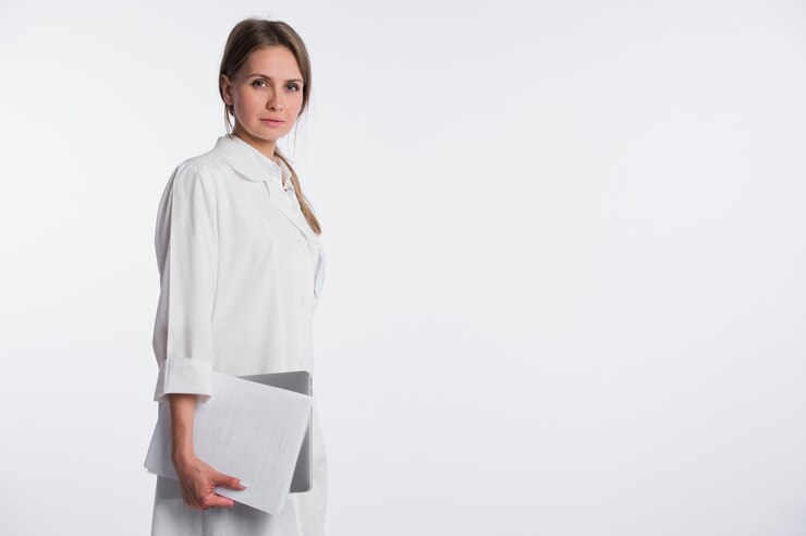 Woman doctor with papers and laptop isolated on the white.