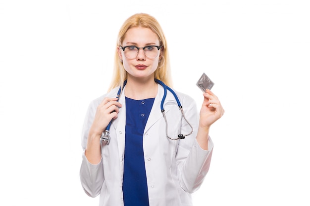 Woman doctor with stethoscope hold condom