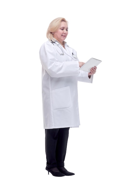 Woman doctor with stethoscope write on tablet