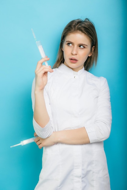 Woman doctor with syringe