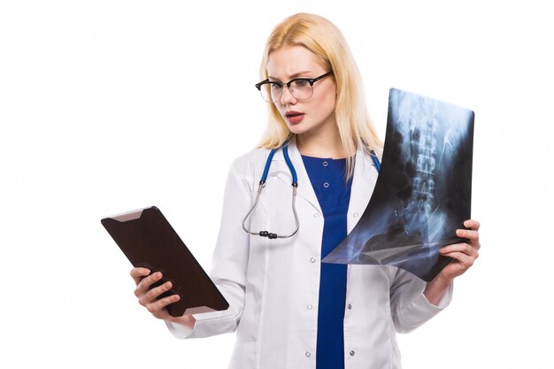 Woman doctor with X-ray and tablet