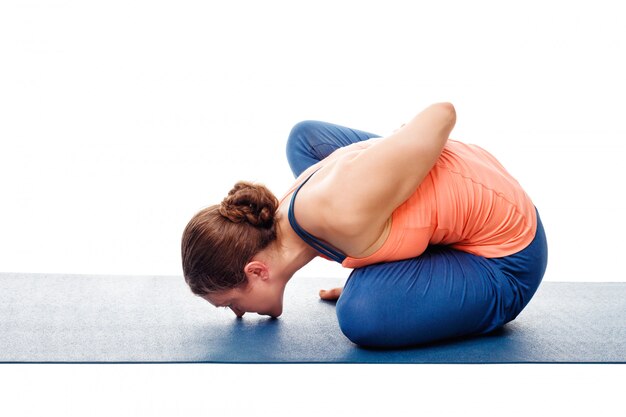 Woman doing Ashtanga Vinyasa Yoga asana Marichyasana B