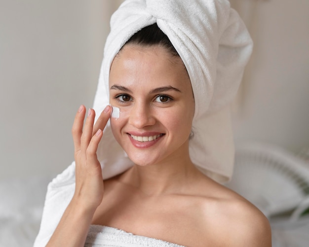 Woman doing a beauty self care treatment indoors