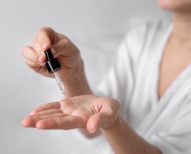 Woman doing a beauty self care treatment indoors