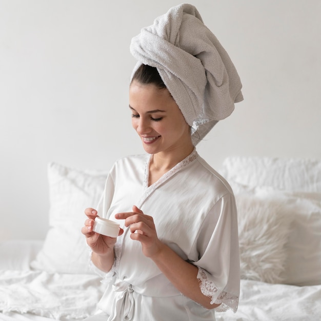 Woman doing a beauty self care treatment indoors