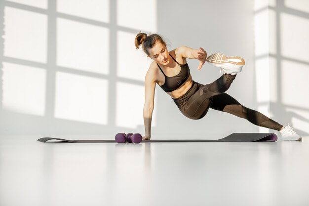 Woman doing cardio fitness indoors