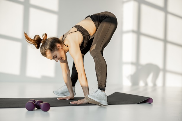 Woman doing cardio fitness indoors