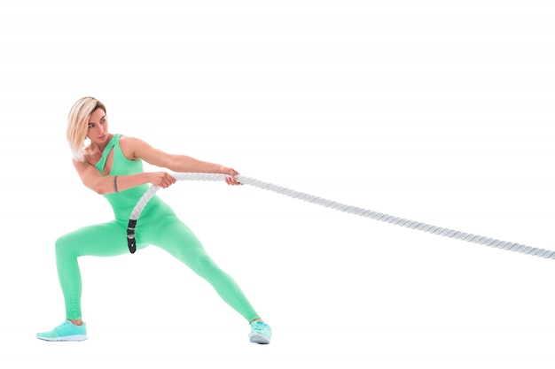 Woman doing exercises with battle rope